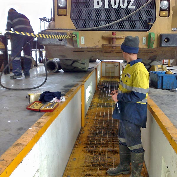 Working on both levels Quickest oil changes in mining workshop pit