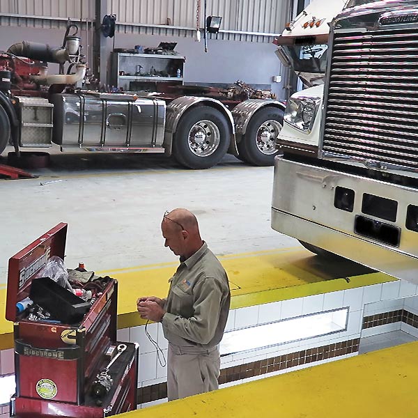 Truck workshop pit with platform